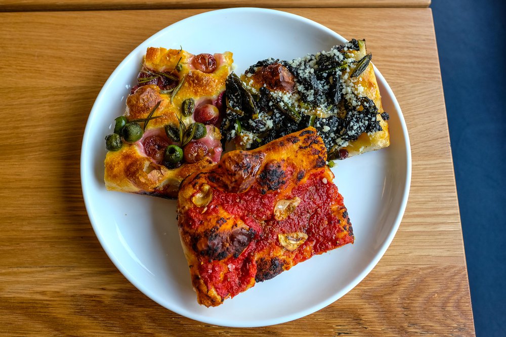Slices of Tomato ($4.50), Grape and Olive ($4.50) and Kale and Currant ($5) Focaccia
