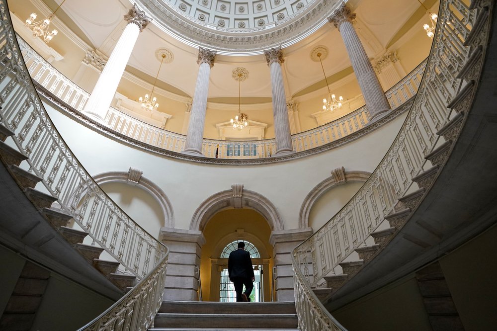 A person walks out of City Hall following a press conference in New York City on Aug 2, 2023.