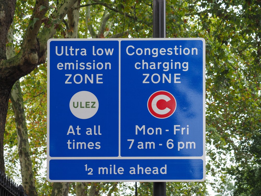 Signs reading "ultra low emission zone" and "congestion zone."