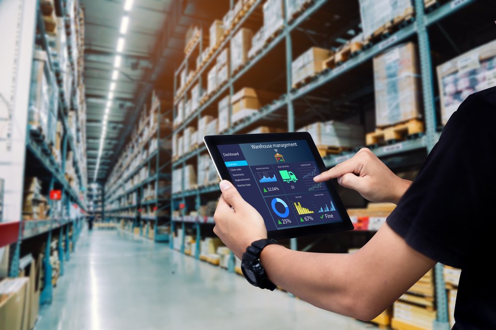 Worker stands in an e-commerce warehouse