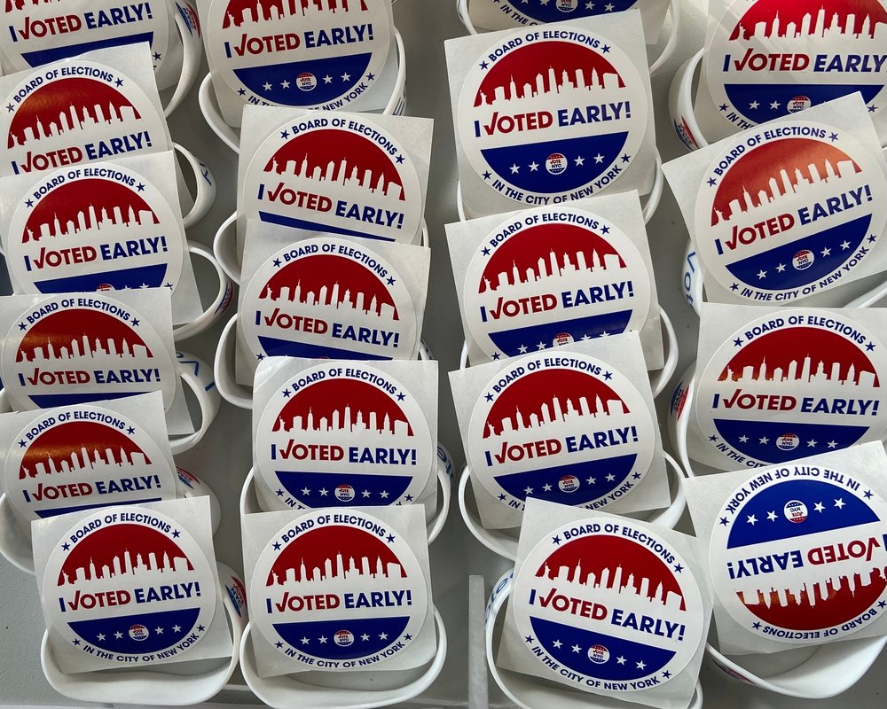 Dozens of "I voted early" stickers lined up.