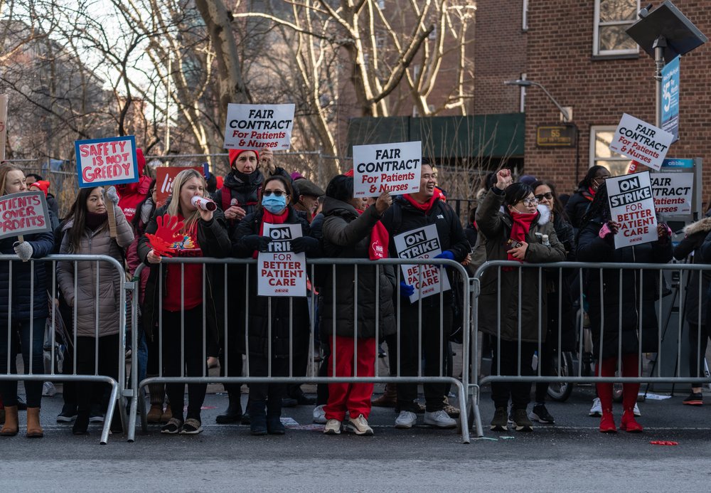Nurses protesting on a picket line.