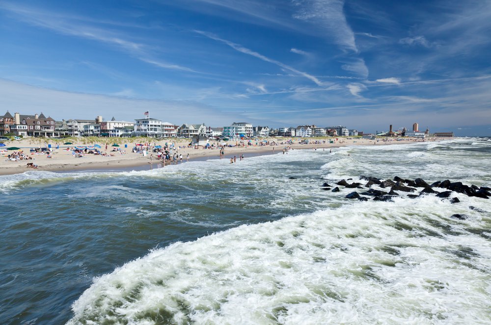 A beach with waves rolling up to shore