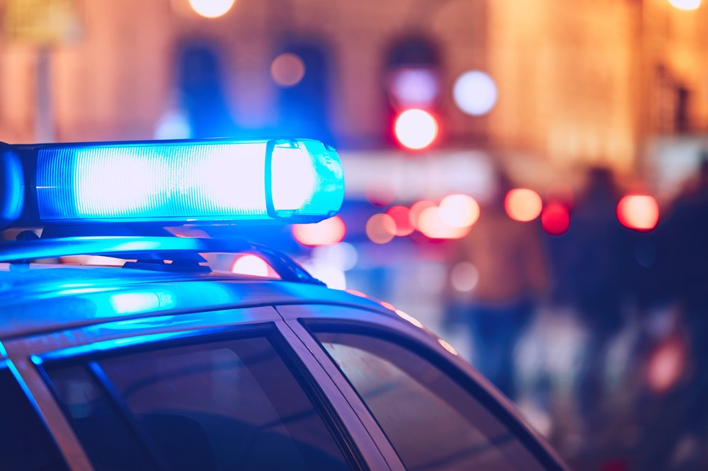 A police siren flashes blue light.
