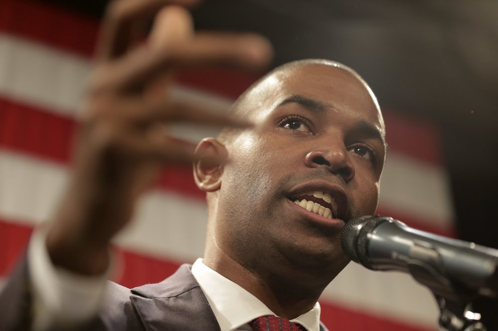 Antonio Delgado speaks at a Democratic watch party on Nov. 6, 2018, in Kingston, N.Y. Delgado is standing in front of an American flag.
