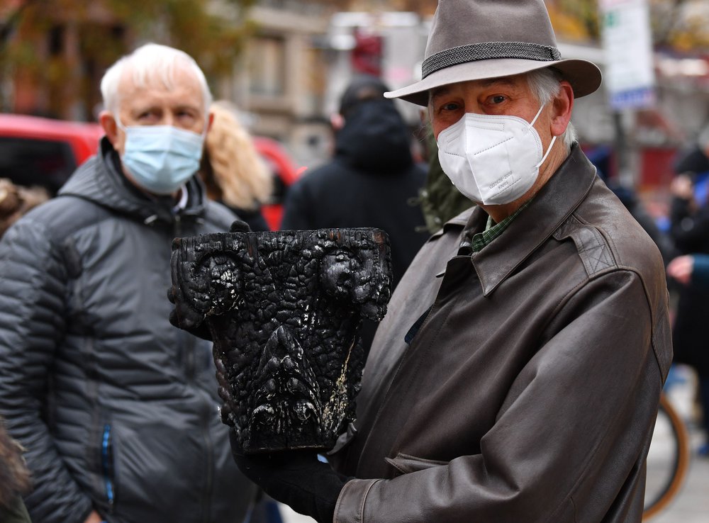 shutterstock_editorial_11184312k.jpg Pete Grenell, a member of the historic Middle Collegiate Church, which was destroyed in a 6 alarm fire, in the East Village early on Saturday morning in New York City, holds a piece of a burnt column given to him by a NYFD fireman.