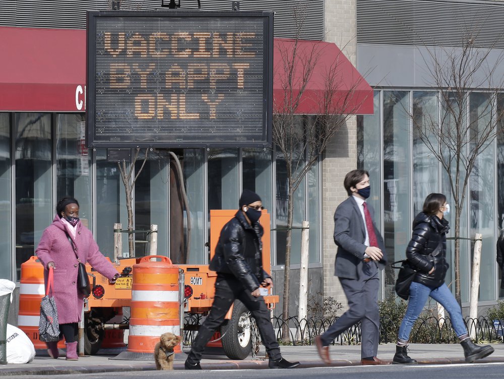Javits K. Center opens as COVID-19 vaccine mega-site. Sign reads: Vaccine by appt only.