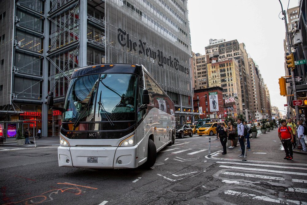 A bus transporting asylum seekers arrives at the Port Authority Bus Terminal in New York