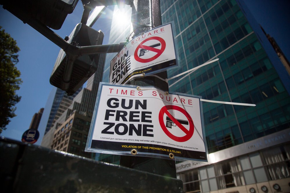 A sign in Times Square notes that the area has been newly designated a "Gun Free Zone."