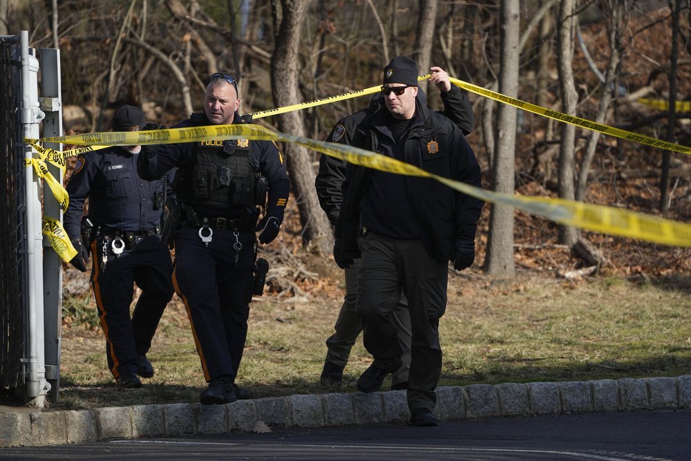 Sayreville, N.J. police on Feb. 2 investigate a wooded area near a townhome community where Councilwoman Eunice Dwumfour was found shot to death the night before.