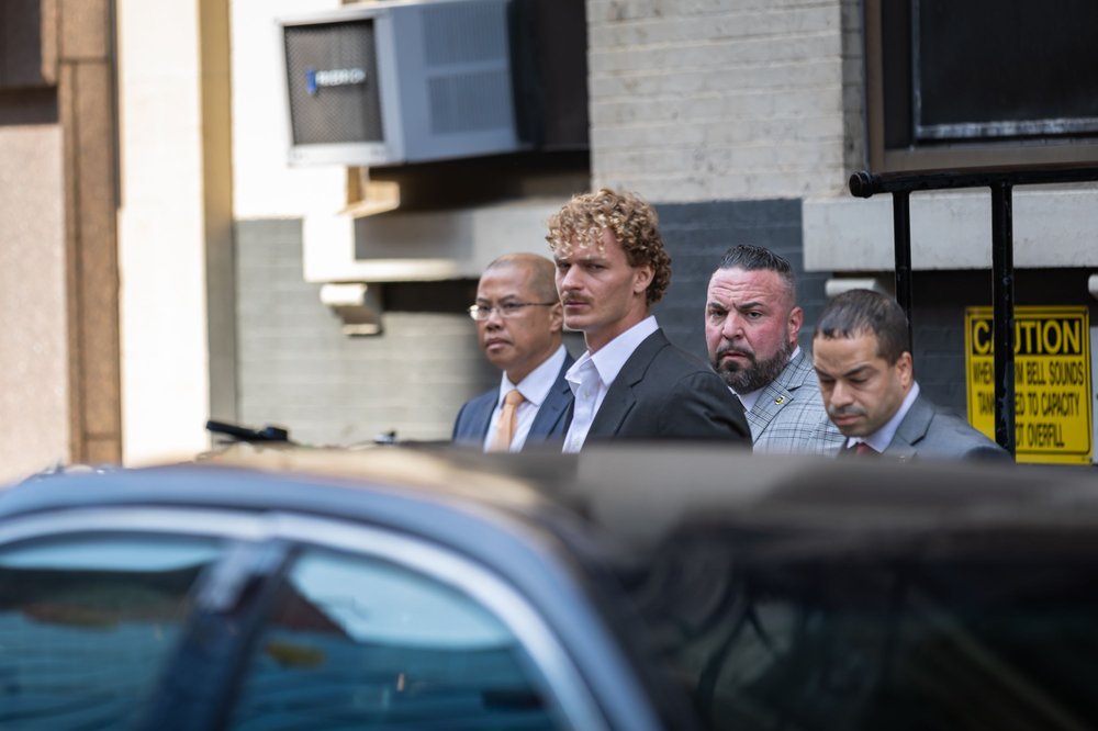 Daniel Penny, 24, is escorted in handcuffs by the NYPD after turning himself into the 5th Precinct in Lower Manhattan on May 12.