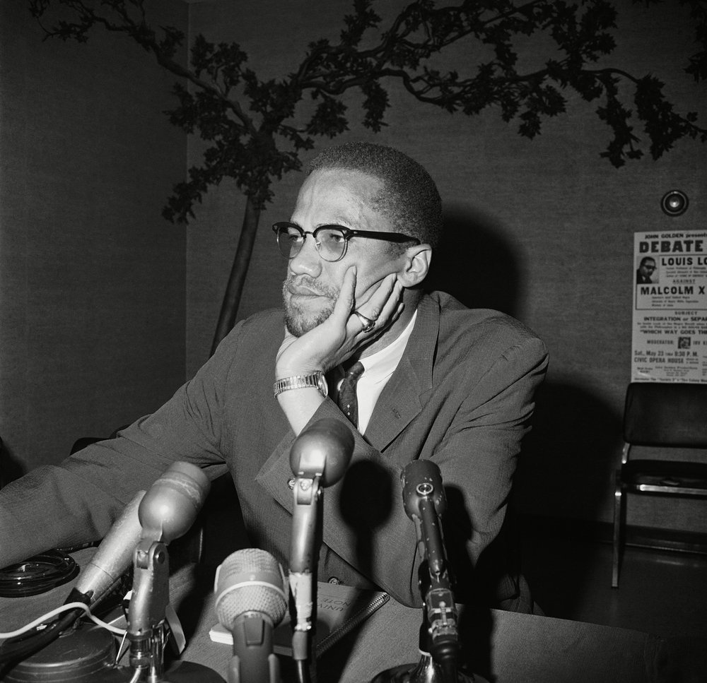 Malcolm X speaks during a press conference in Chicago on May 22nd, 1964.