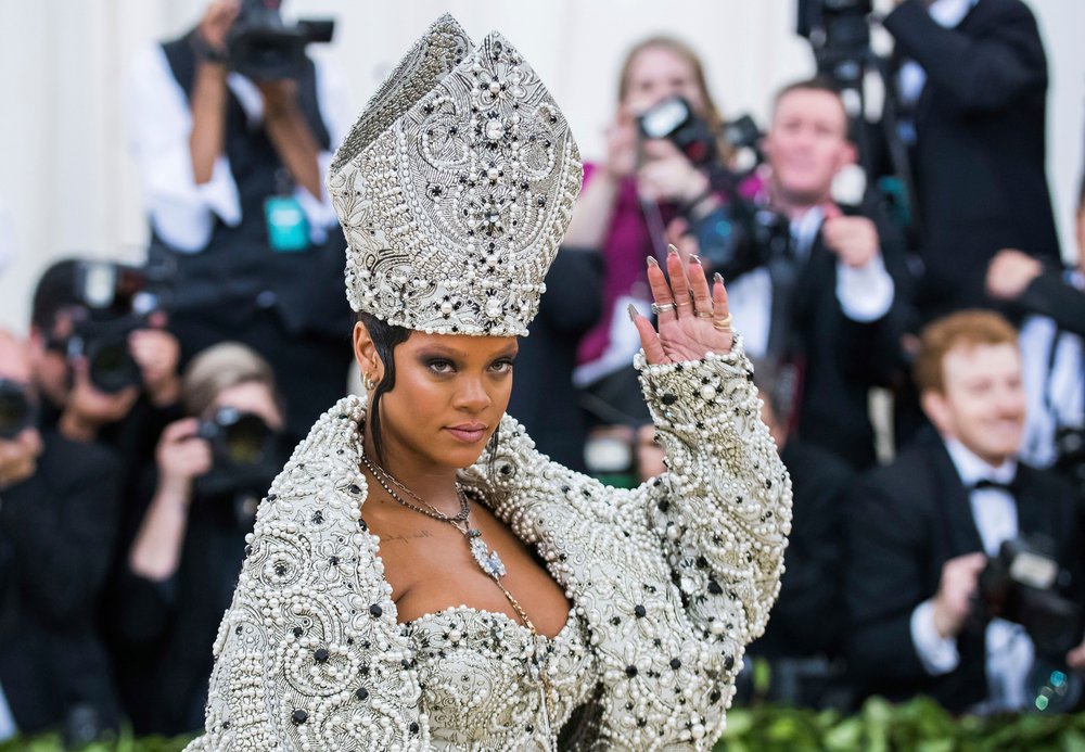 Close up of Rihanna in silver and white mitre