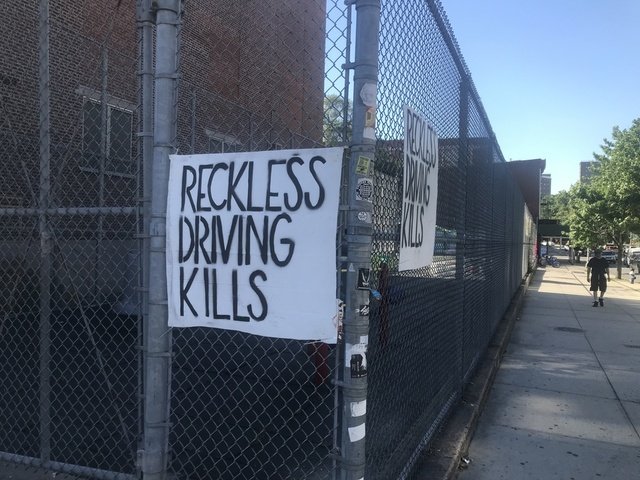 A sign at the intersection where Devra Freelander was struck and killed on Monday