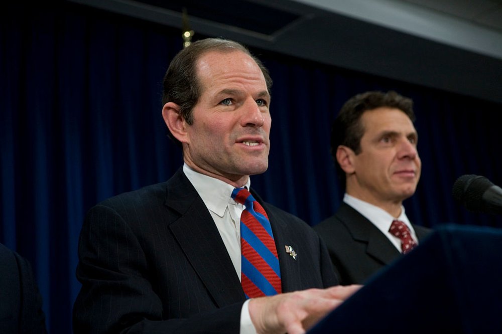 Eliot Spitzer and Andrew Cuomo at a podium