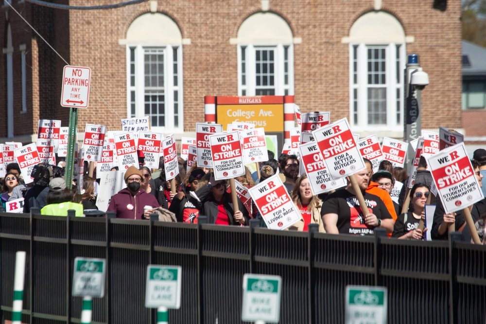 Faculty members at Rutgers are picketing despite a threat of legal action from the university, which maintains public worker strikes are illegal.