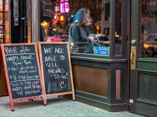 A chalkboard that reads: "We are able to sell to-go drinks"