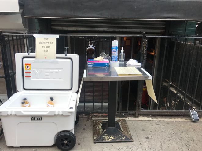 To-go-cocktails being sold on the sidewalk in 2020.