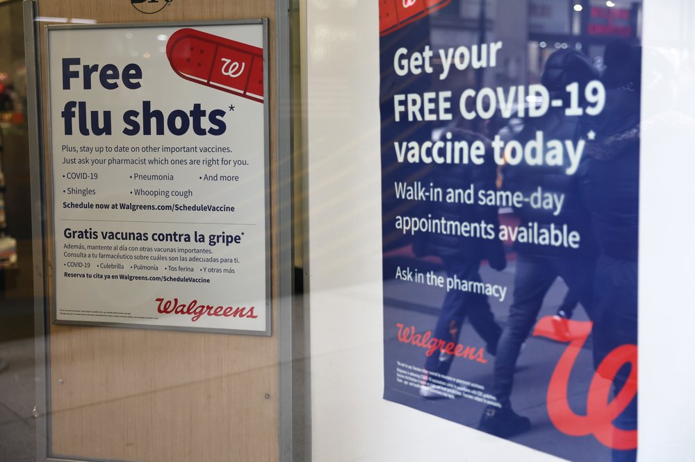 Flu and COVID-19 vaccine signage seen at a Duane Reade in New York City, Jan. 05, 2023.