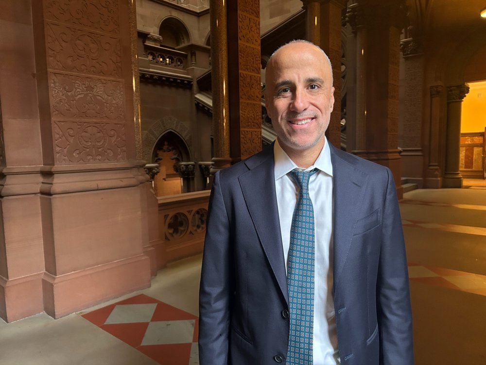 A bald man in a suit.
