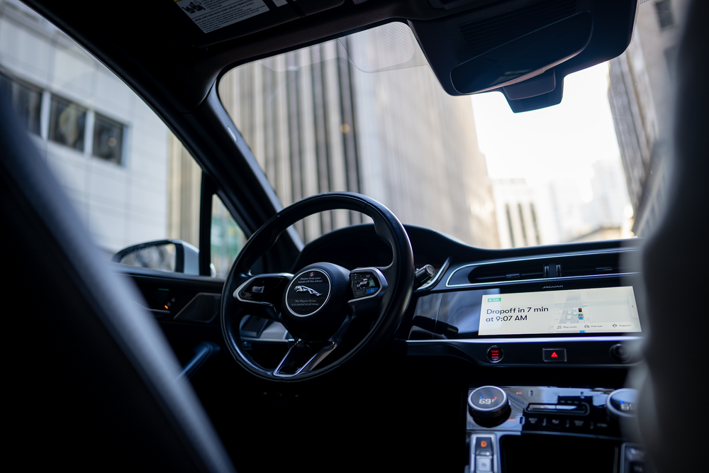 A photo of the inside of a driverless ride-share vehicle in Waymo's fleet