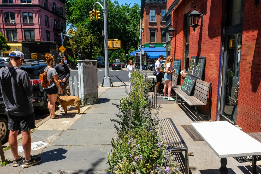 a social distanced line outside of Winner