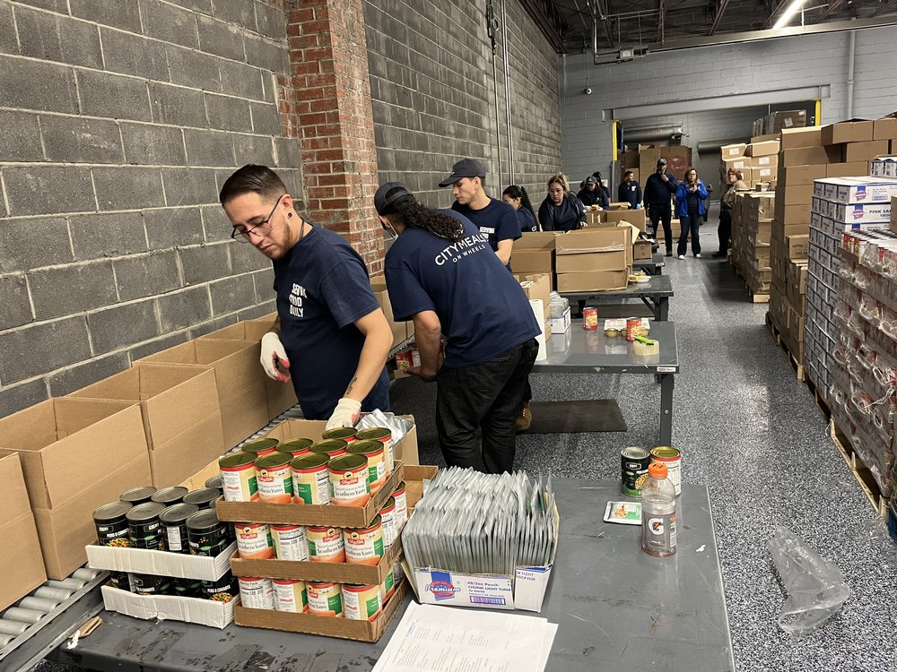 Workers at the Citymeals warehouse in the Bronx pack emergency boxes for winter. They provide seniors with six shelf-stable meals to keep on hand in case regular deliveries are disrupted by bad weather.