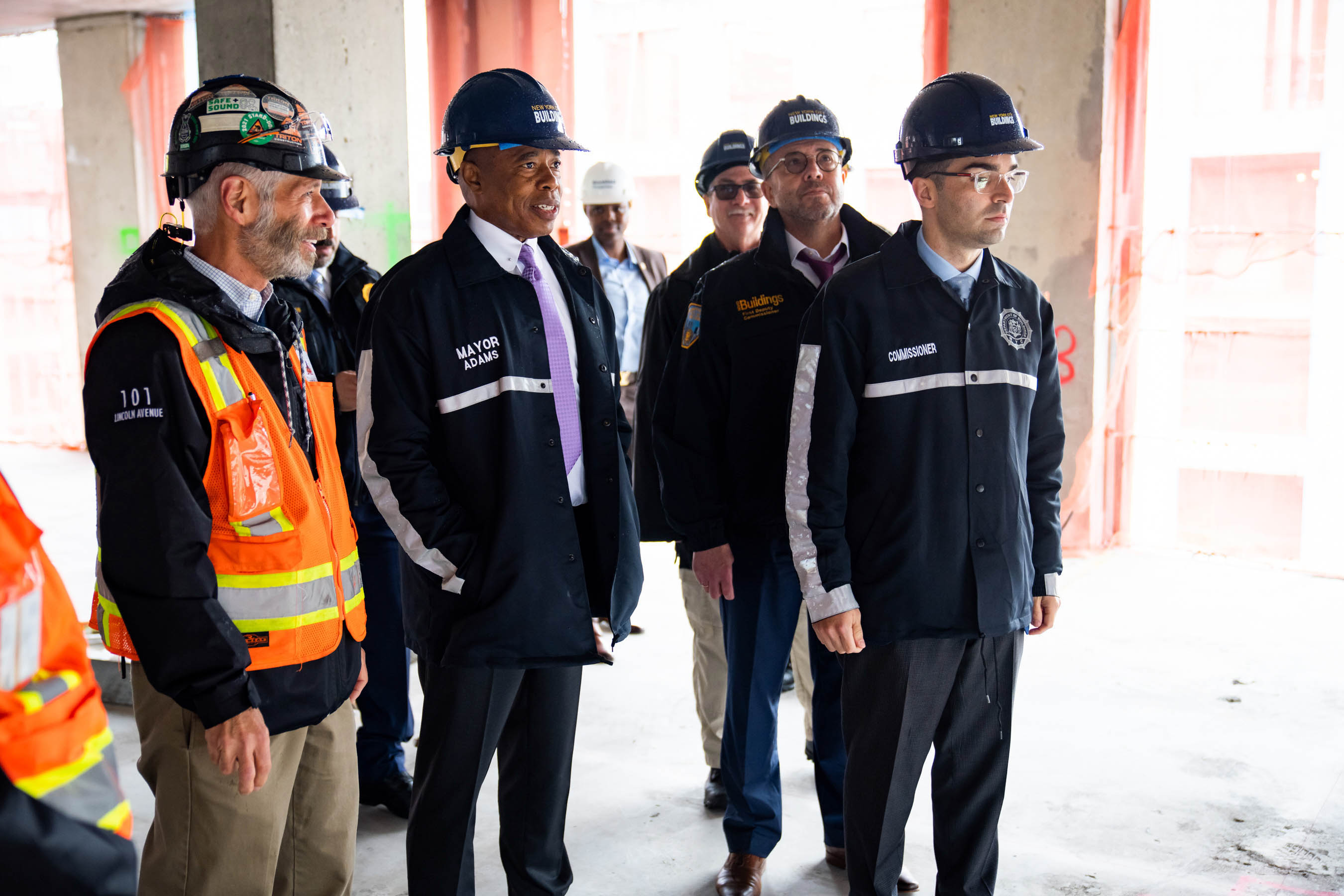 Mayor Eric Adams in a hardhat with other officials.