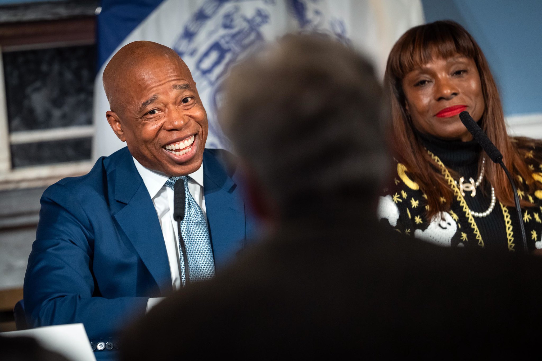 Mayor Eric Adams and Ingrid Lewis-Martin smile during  press conference.