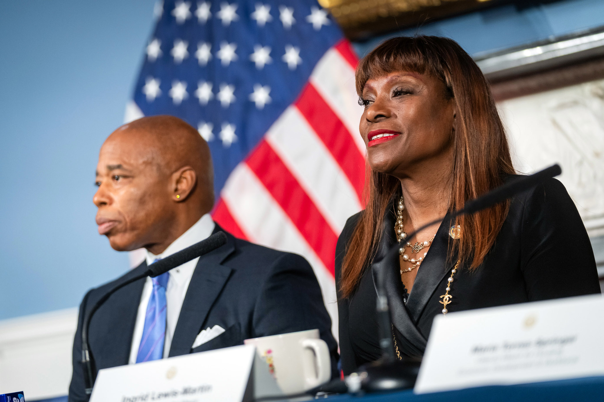 Eric Adams and Ingrid Lewis-Martin at a table.