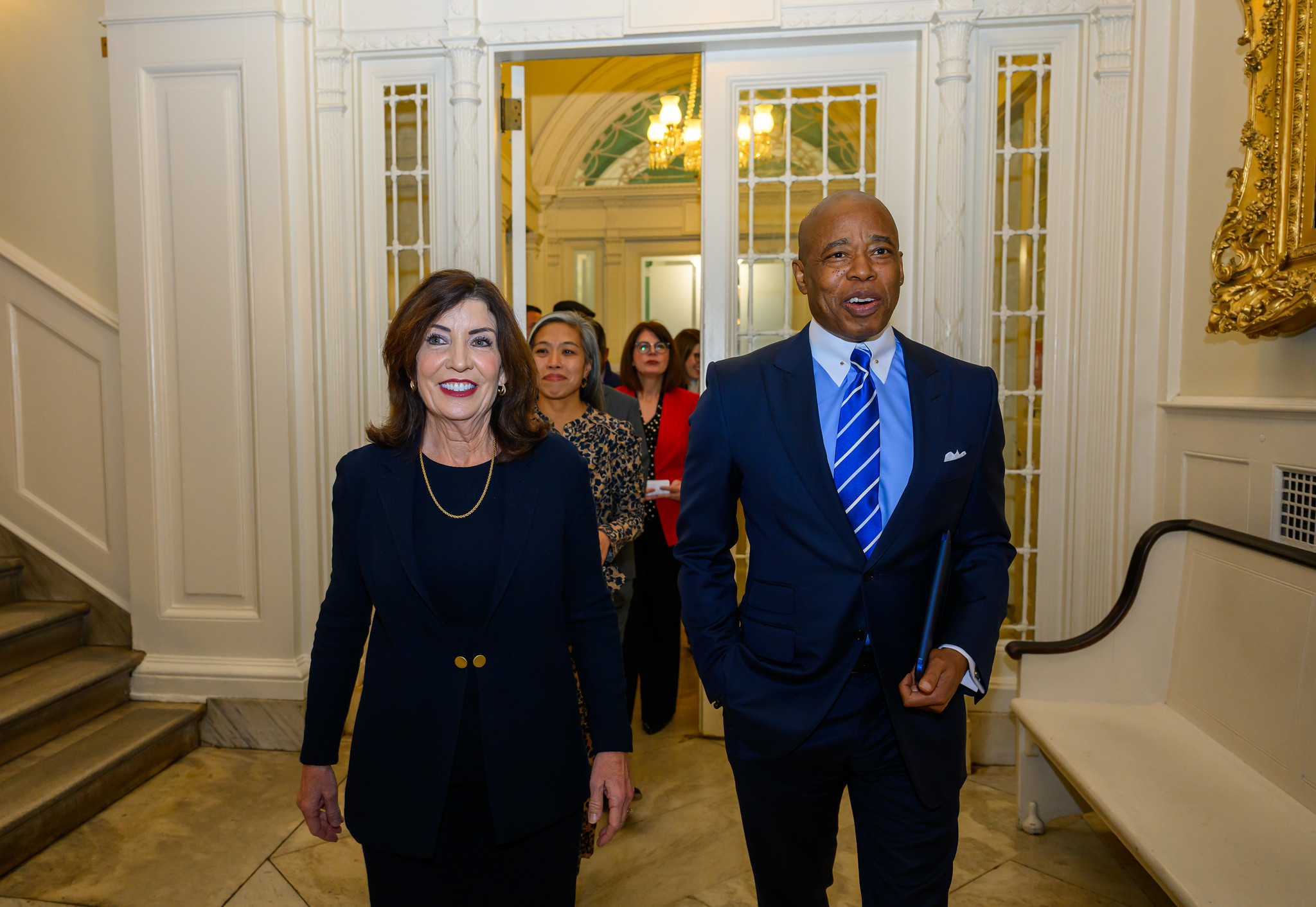 Gov. Kathy Hochul and Mayor Eric Adams walk together at City Hall