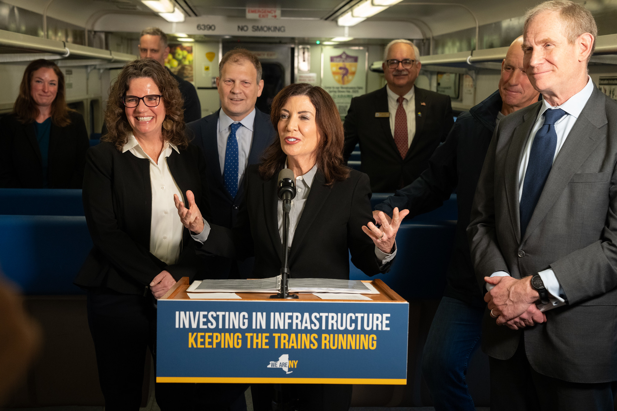 Gov. Kathy Hochul gives a press conference on board a train.