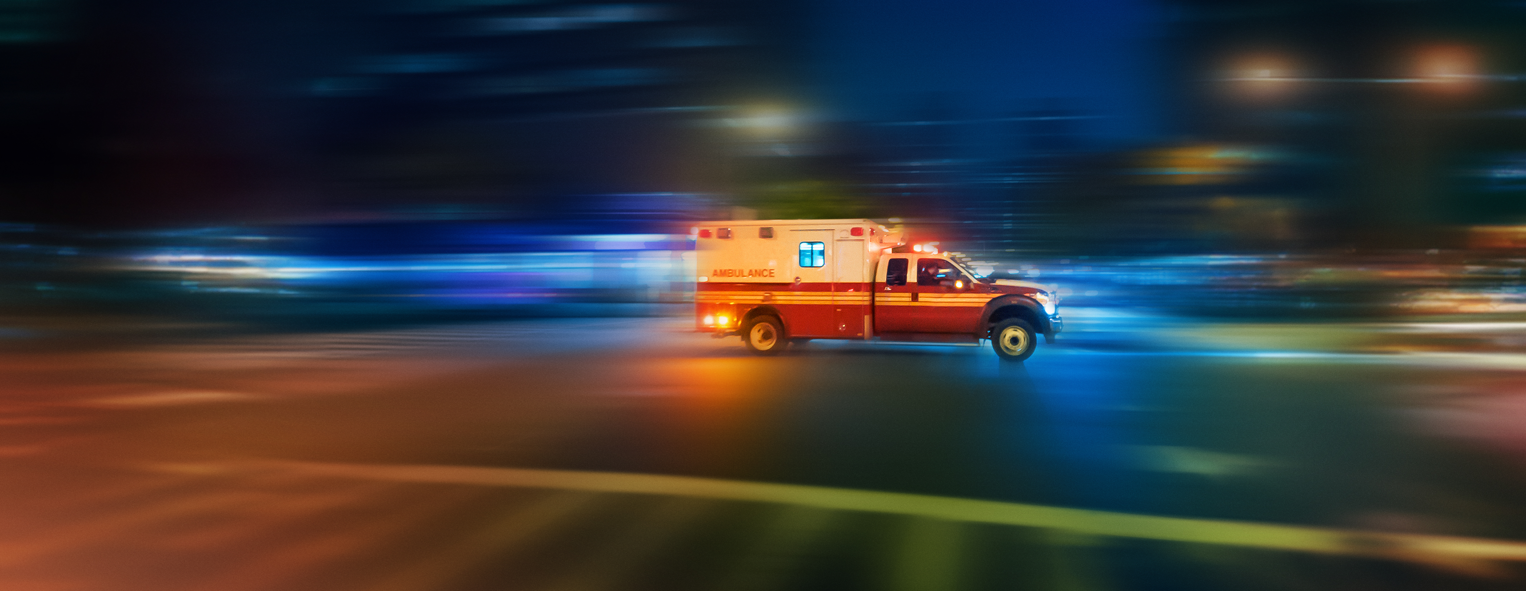 A stock image of a speeding ambulance