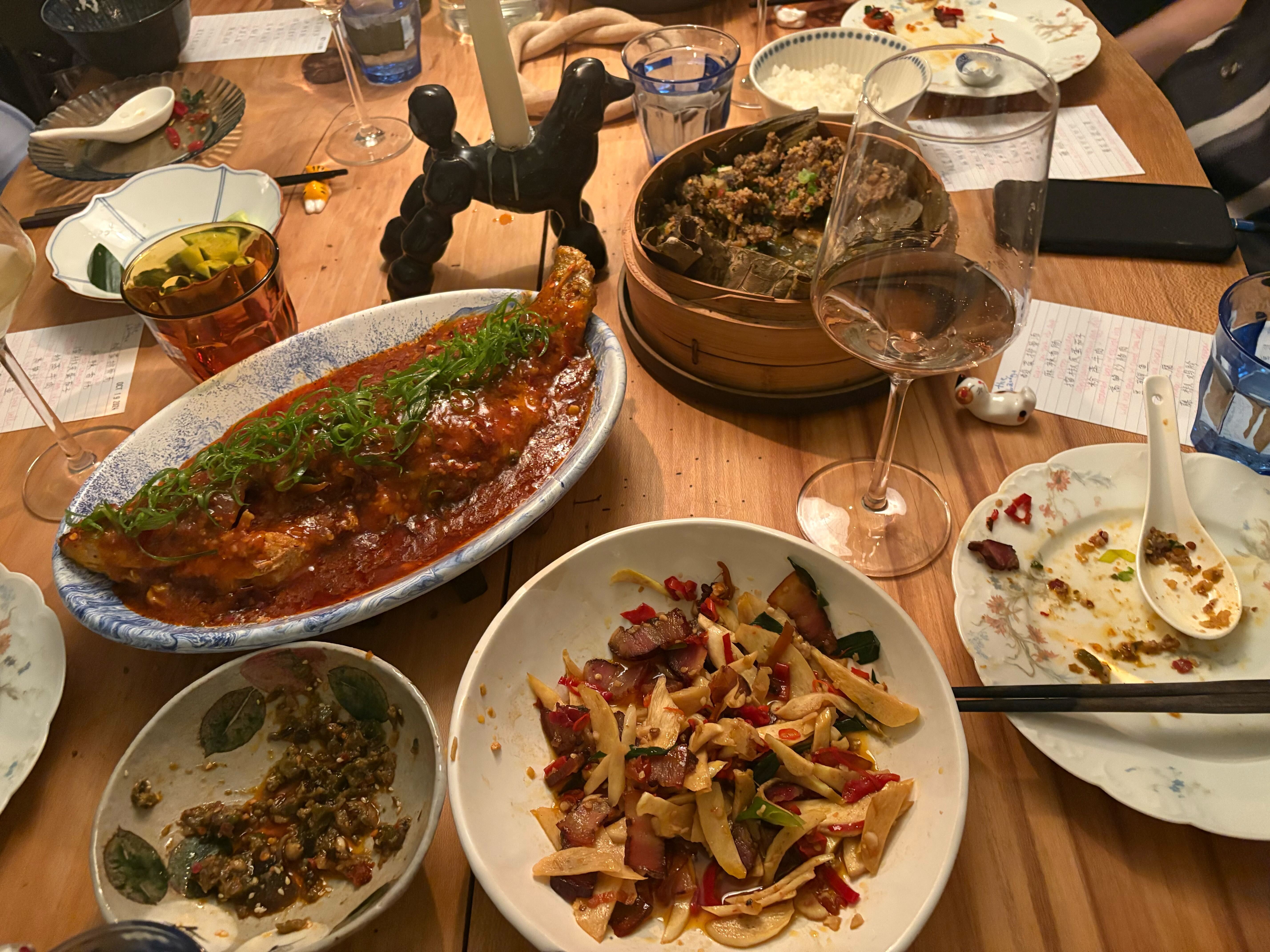 Dishes of Sichuan food on a table.