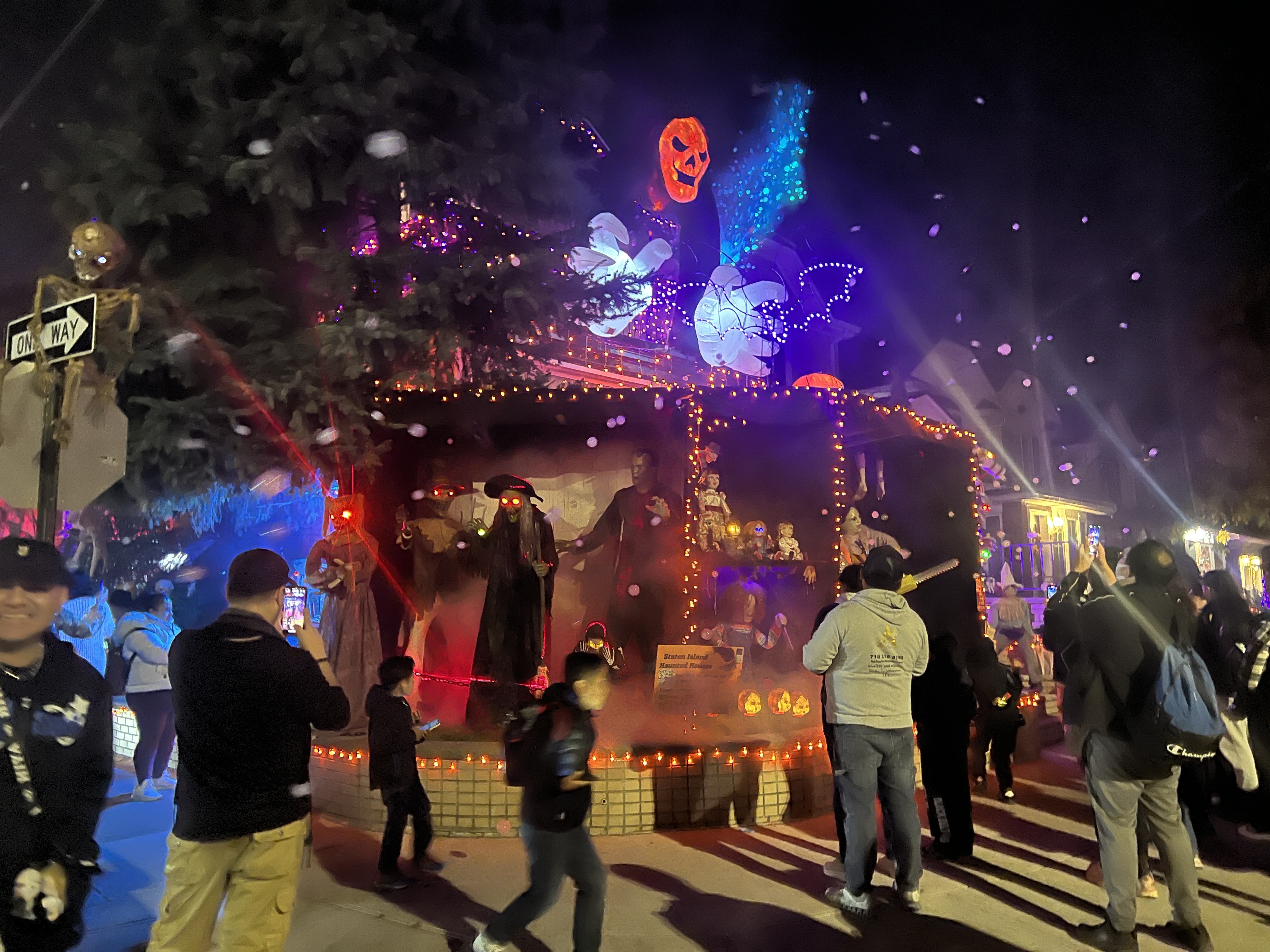 An elaborate Halloween display in front of a house.