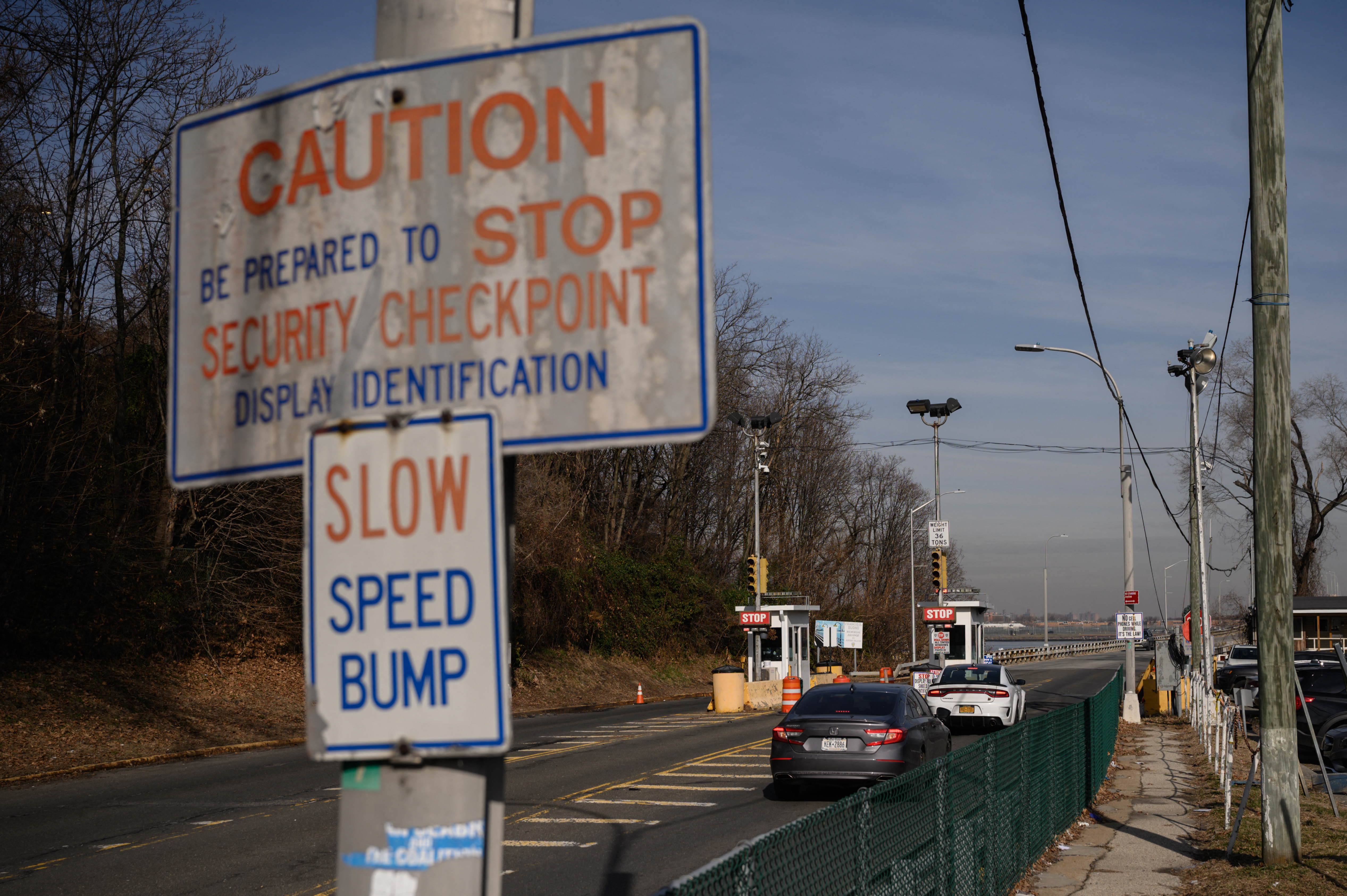 A general view shows a checkpoint at the entrance to a bridge leading to the Rikers Island jail complex in Queens.