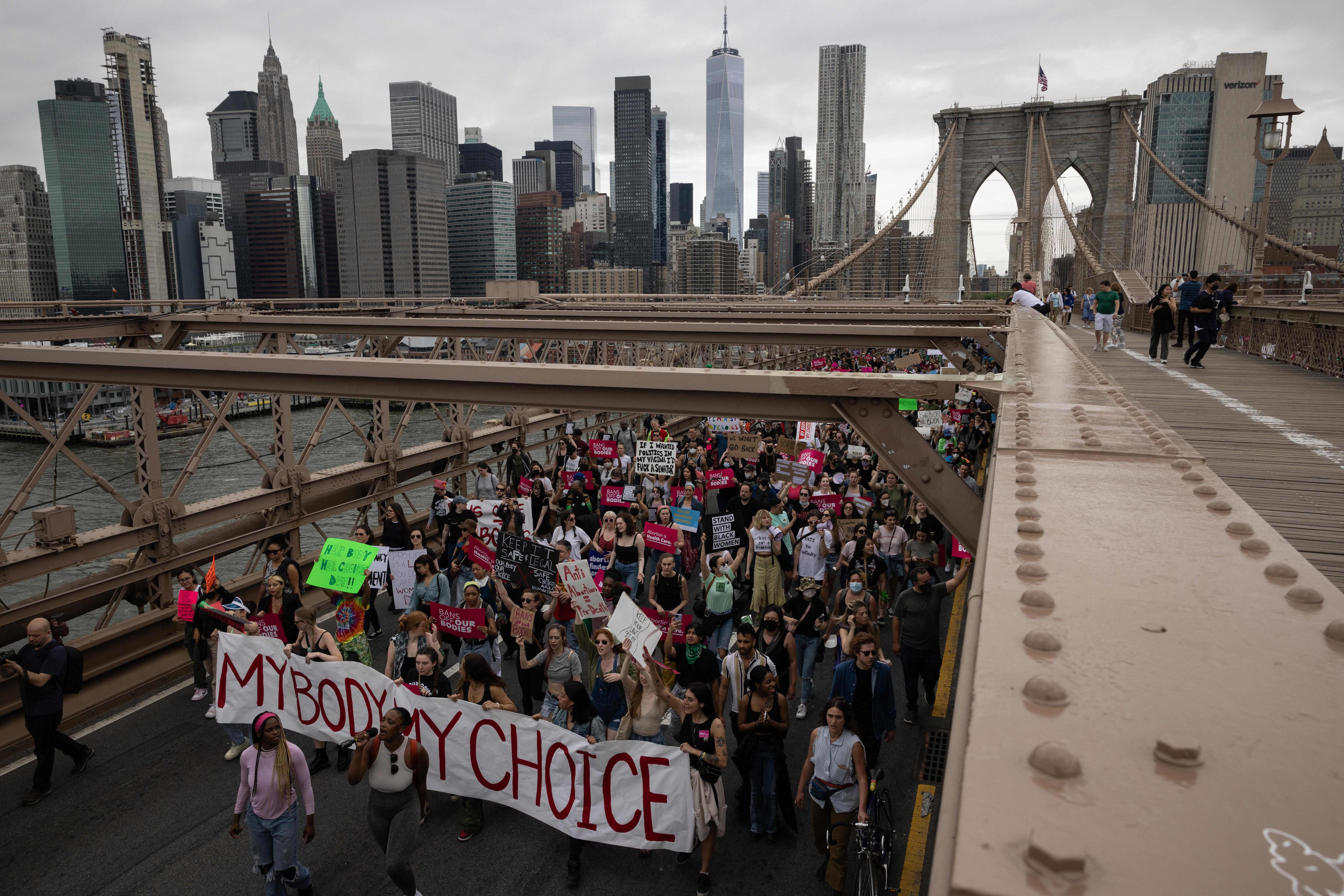 Demonstrators march on the Brooklyn Bridge during an abortion rights rally ahead of the Supreme Court's 2022 decision overturning Roe v. Wade, the nearly 50-year-old ruling that created a constitutional right to an abortion.