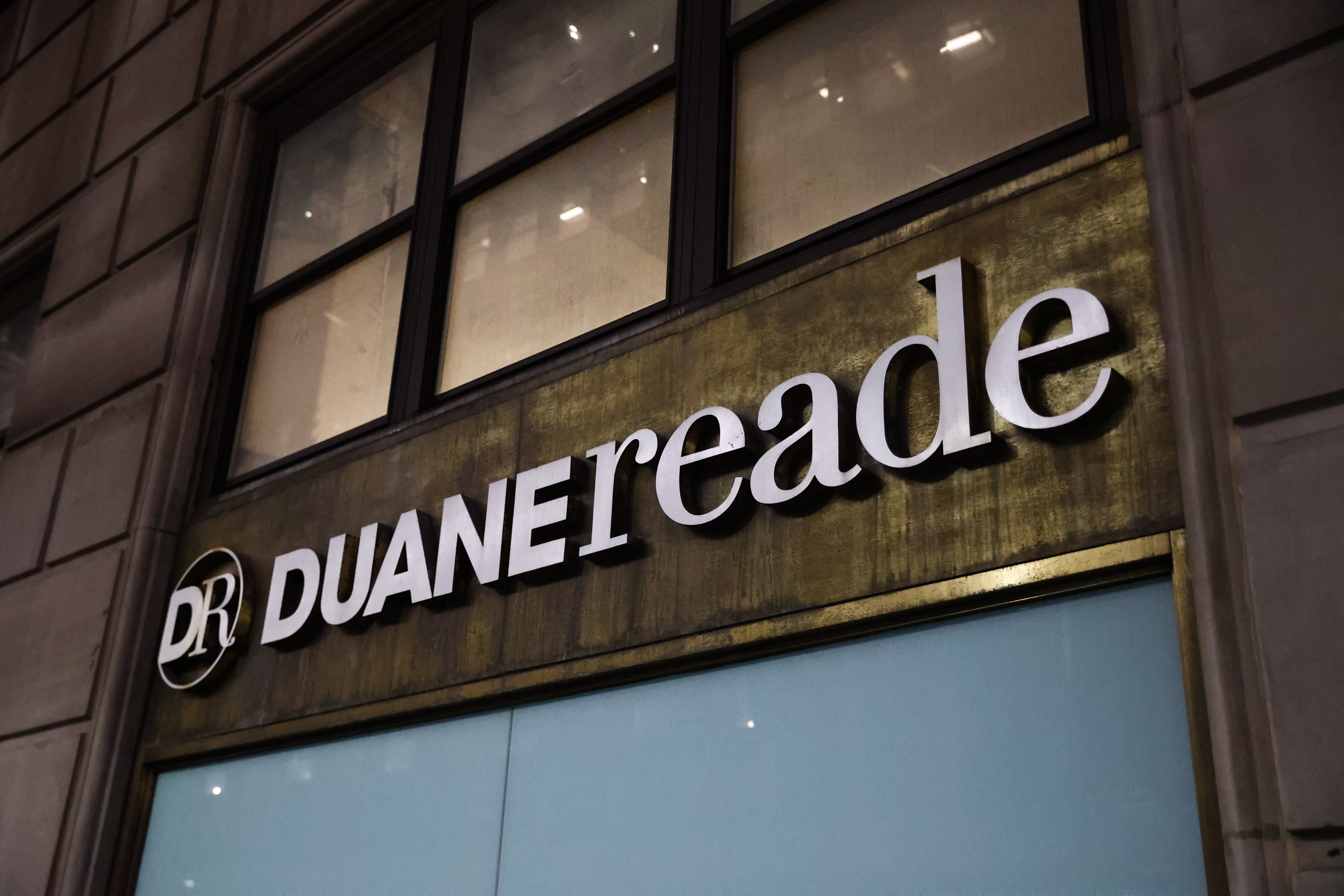 A Duane Reade logo on a building in New York City.