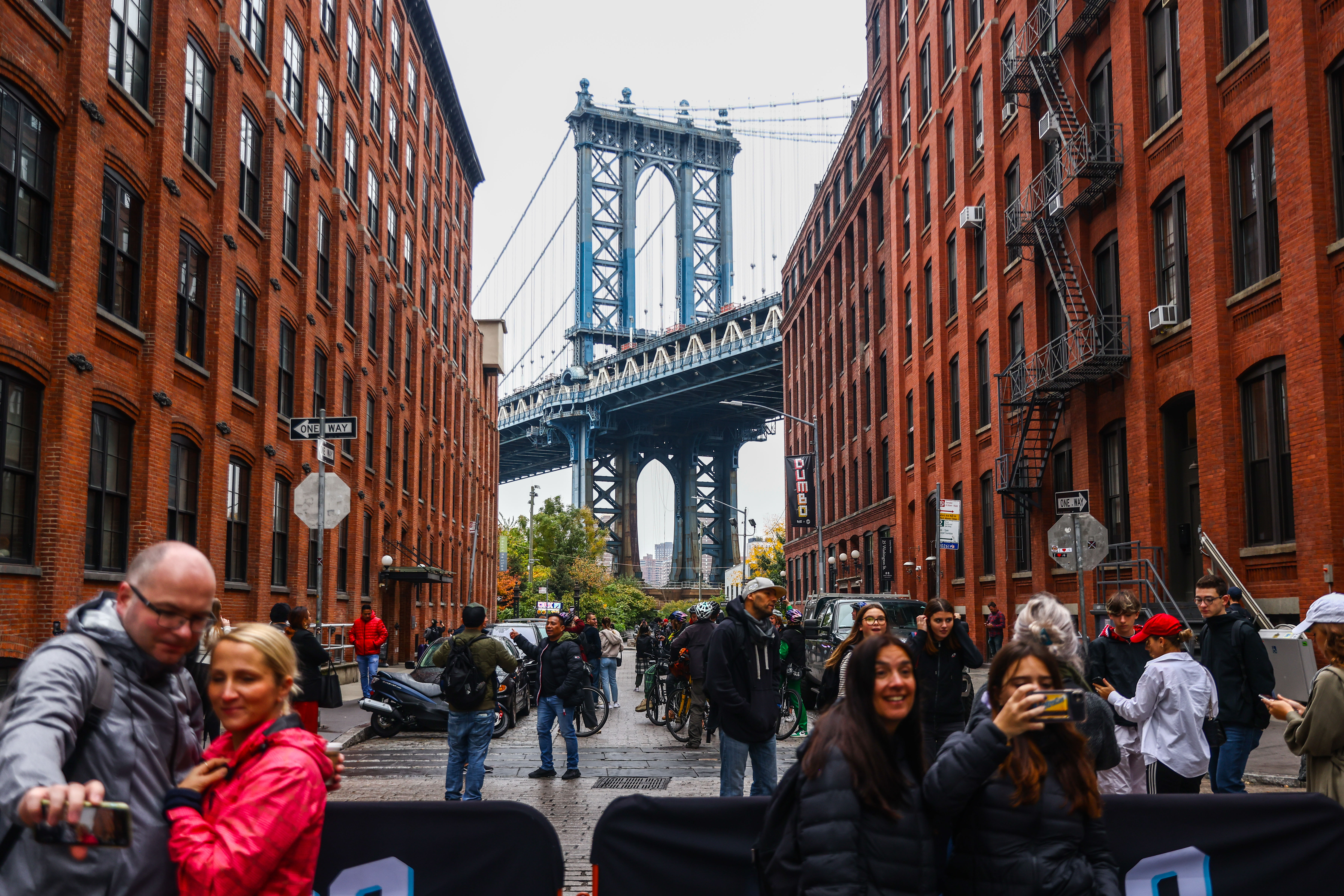 Tourists take selfies in Dumbo.