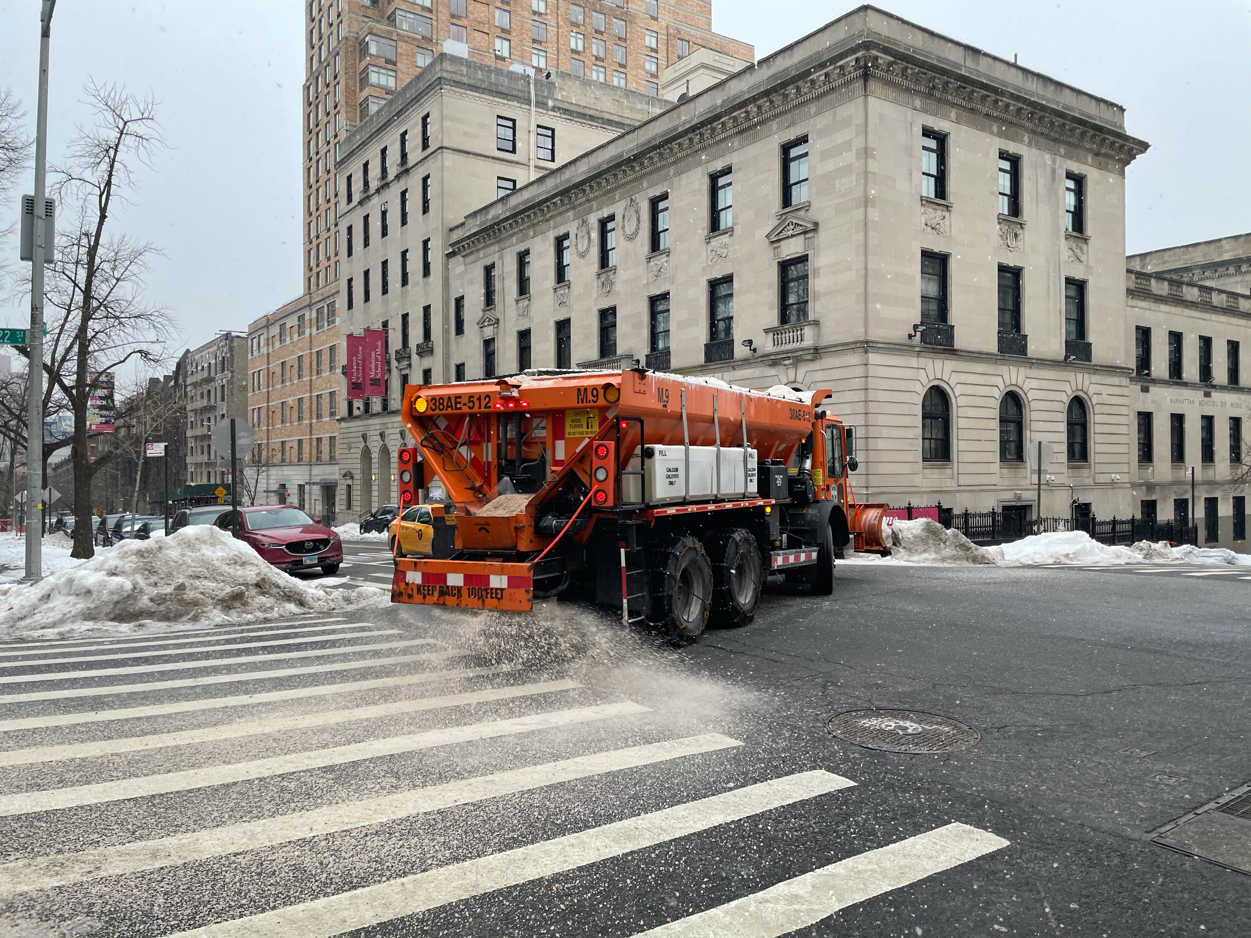 A sanitation truck spreads salt on the Upper West Side on Feb. 7, 2021.