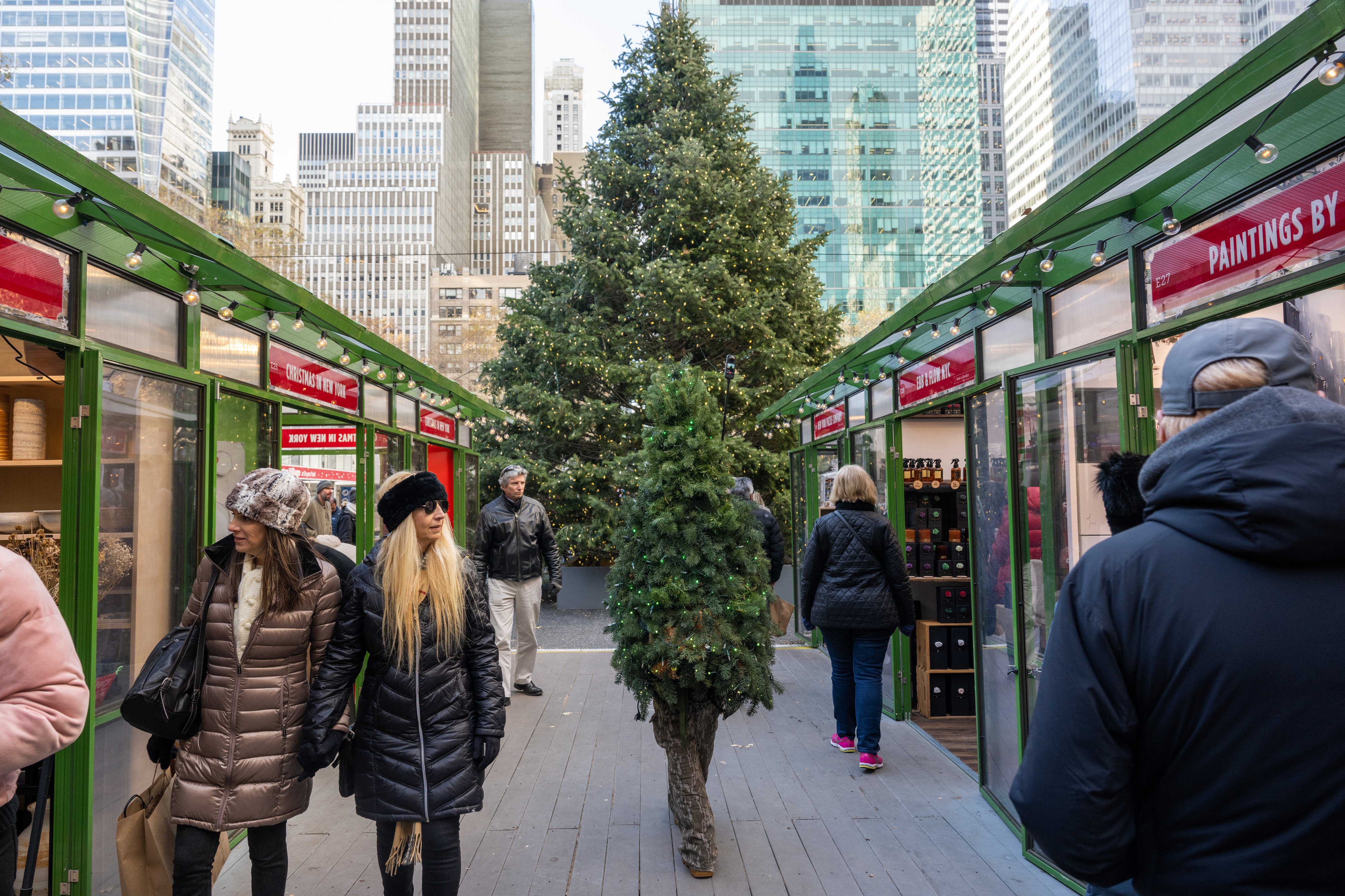 Shoppers browse the holiday market at Bryant Park on Dec. 19, 2022.