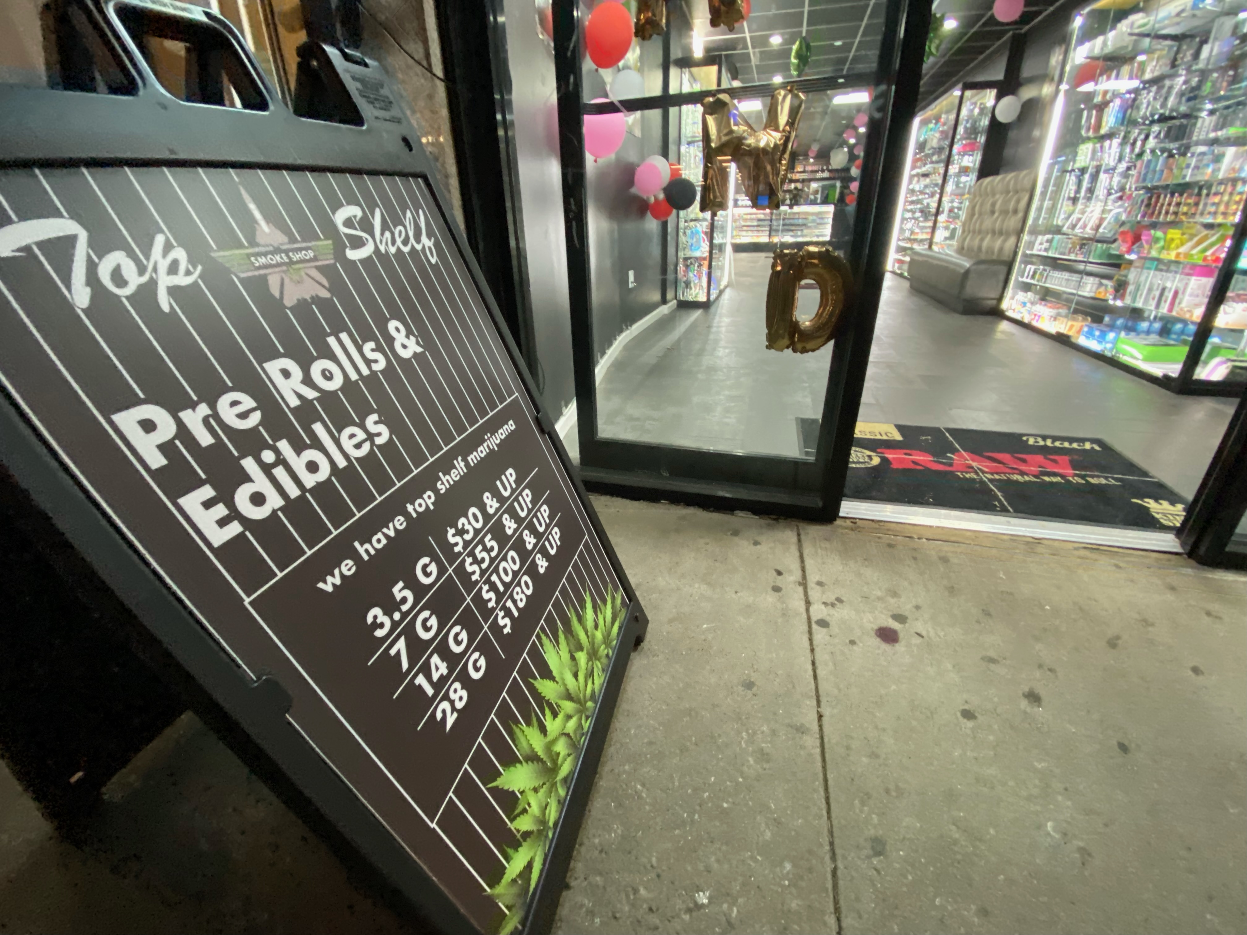 A sign outside of a cannabis shop in Queens.