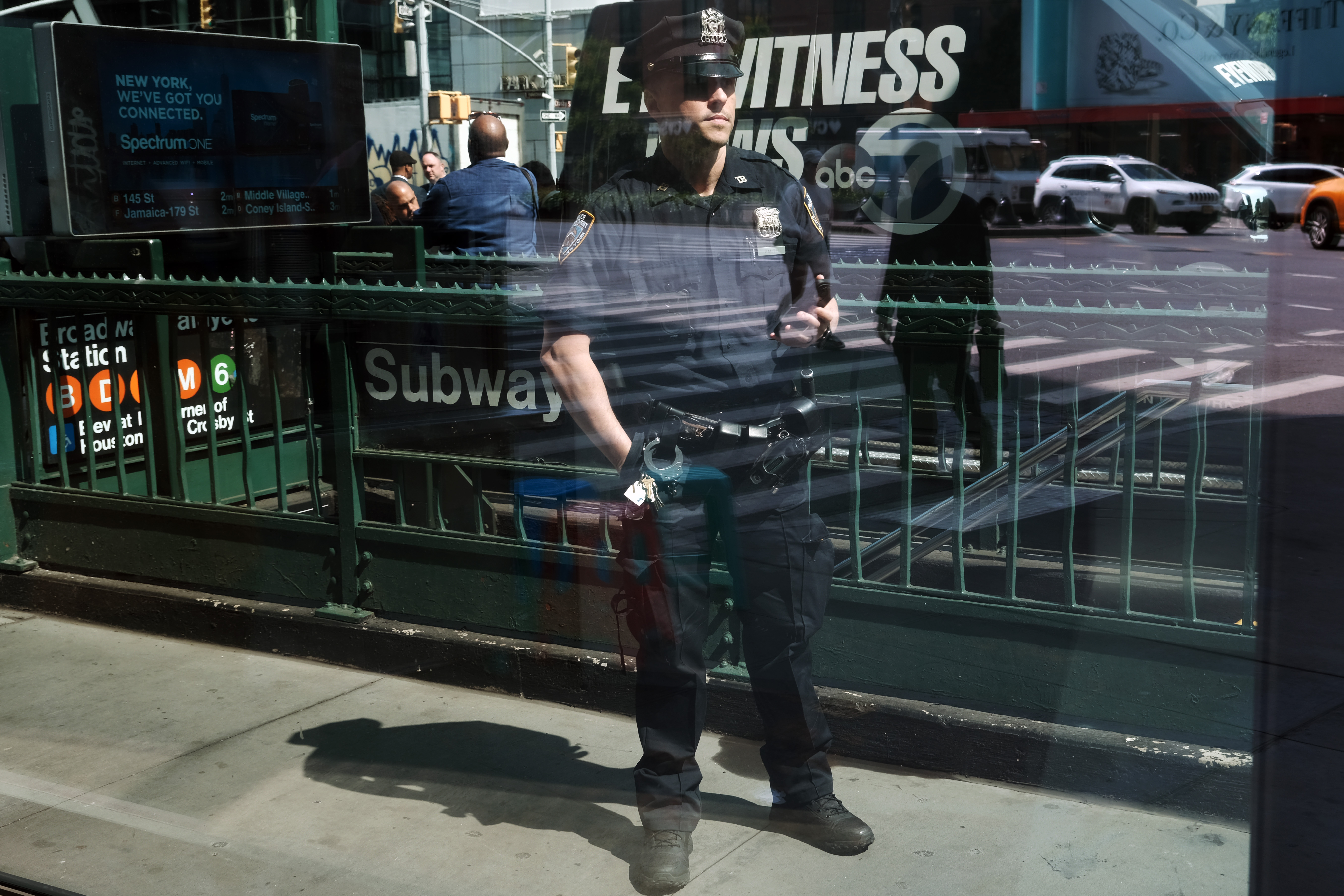 Police stand outside a subway station.