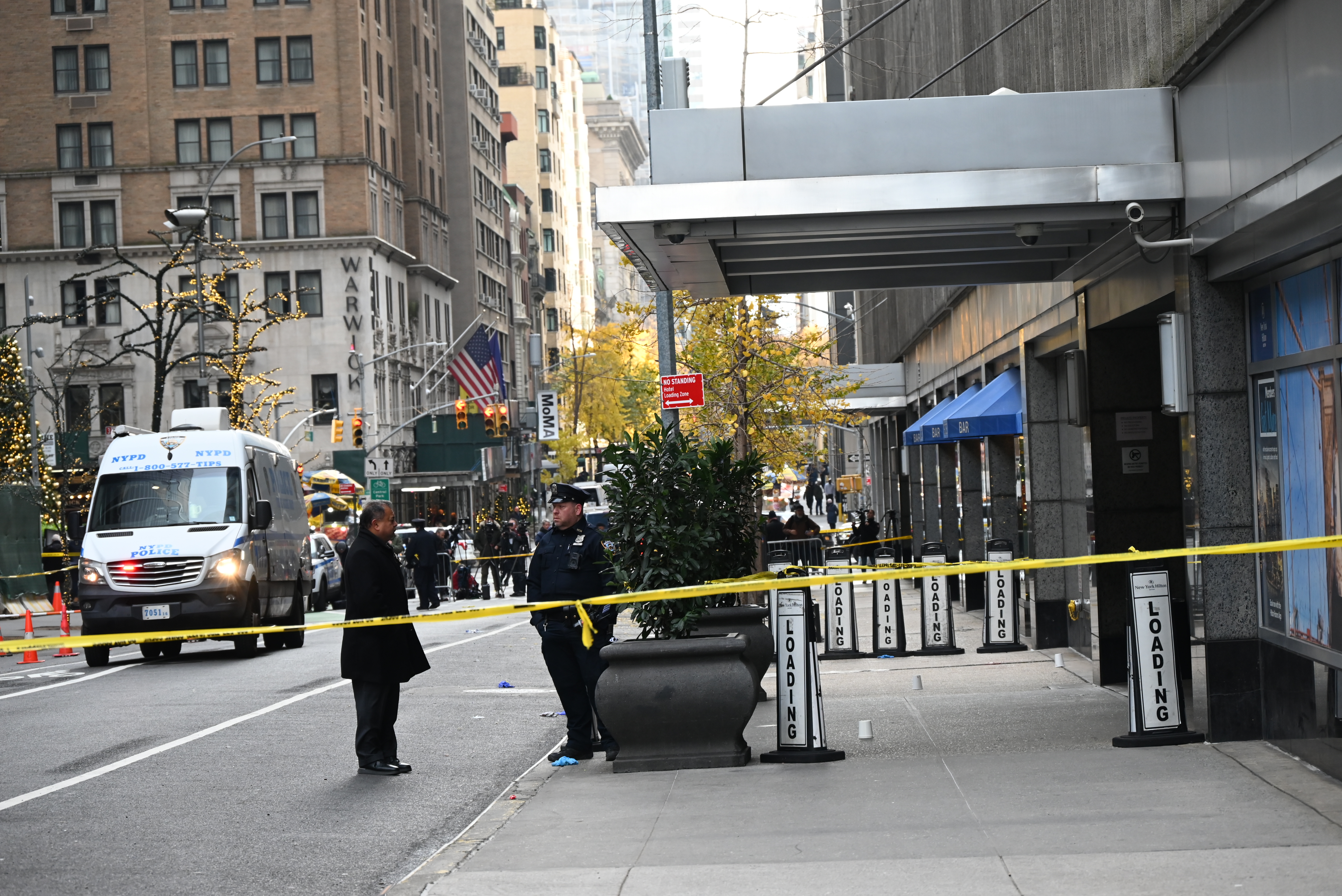 Police officers take security measures as CEO of UnitedHealthcare Brian Thompson shot and killed in Midtown Manhattan.