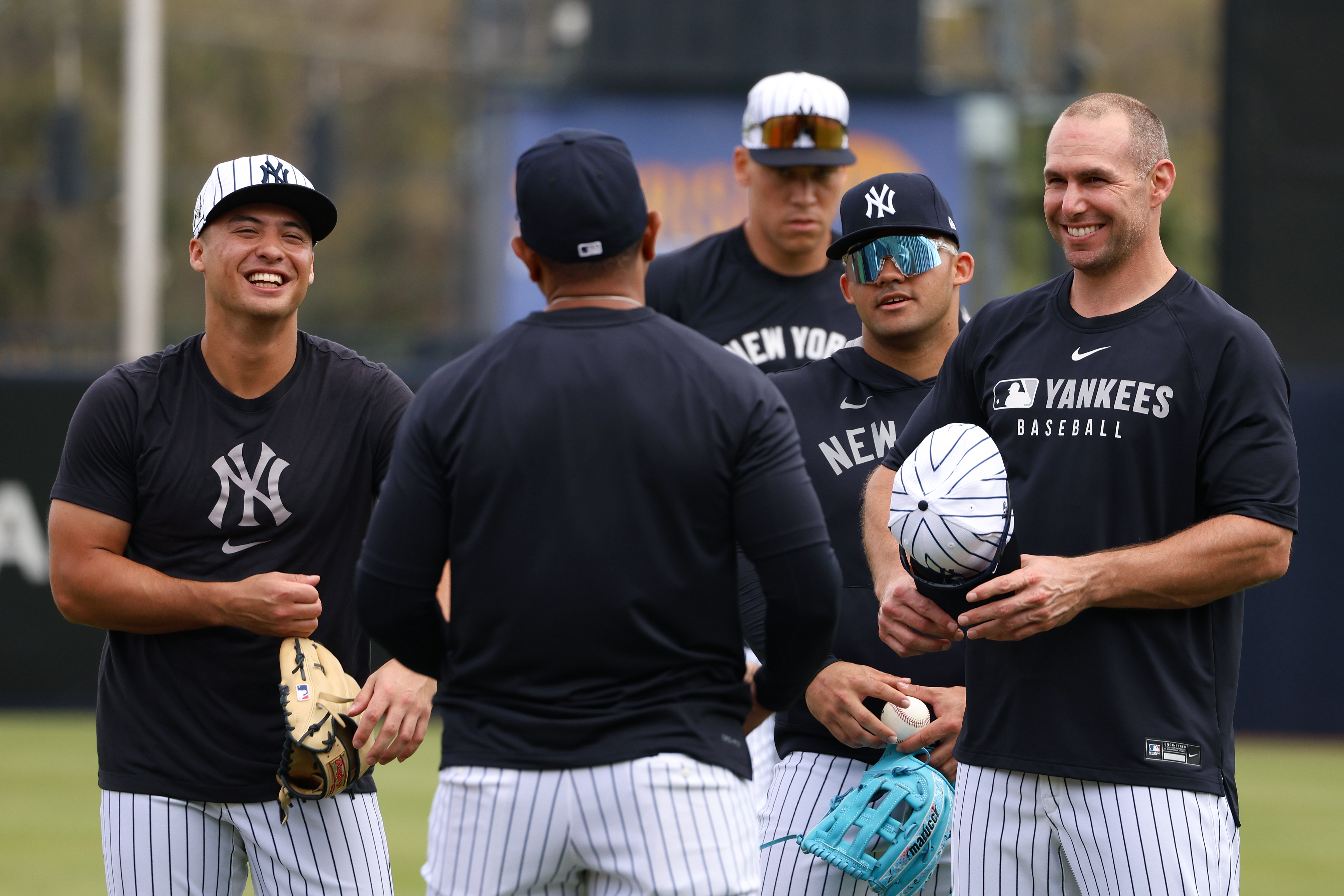 Yankees Anthony Volpe #11, Jasson Domínguez #24 and Paul Goldschmidt #48 talk during spring training in Tampa, Florida, on Feb. 19, 2025.