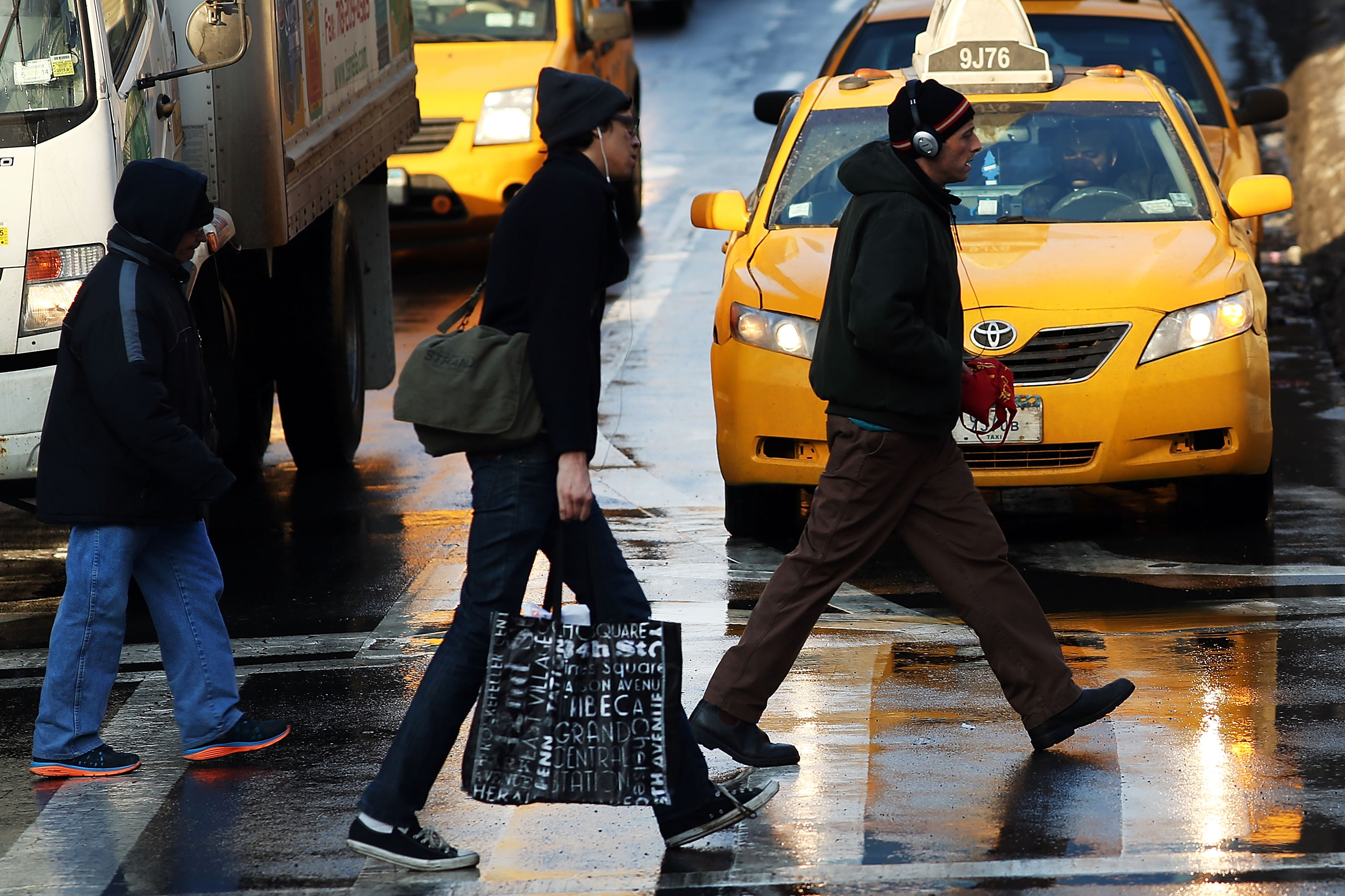 People crossing at an intersection in New York City.