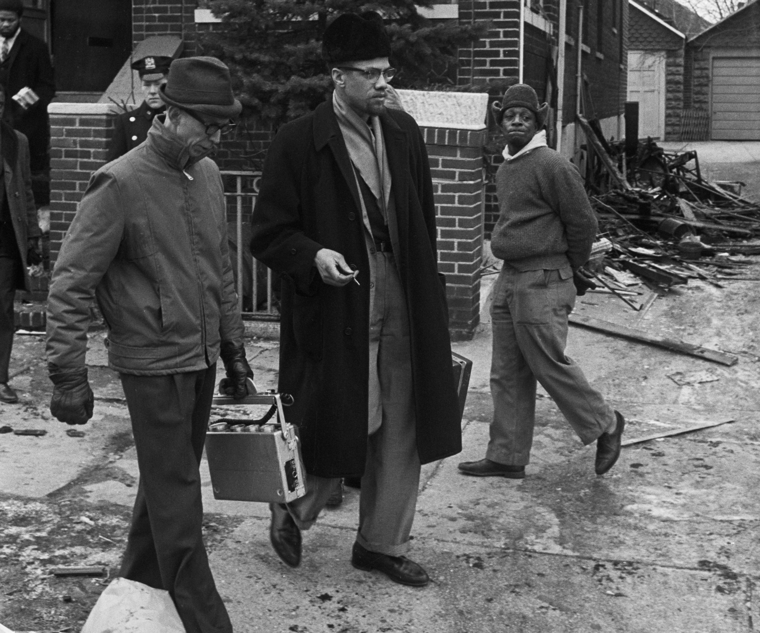 Malcolm X leaves his firebombed home in February 1956.