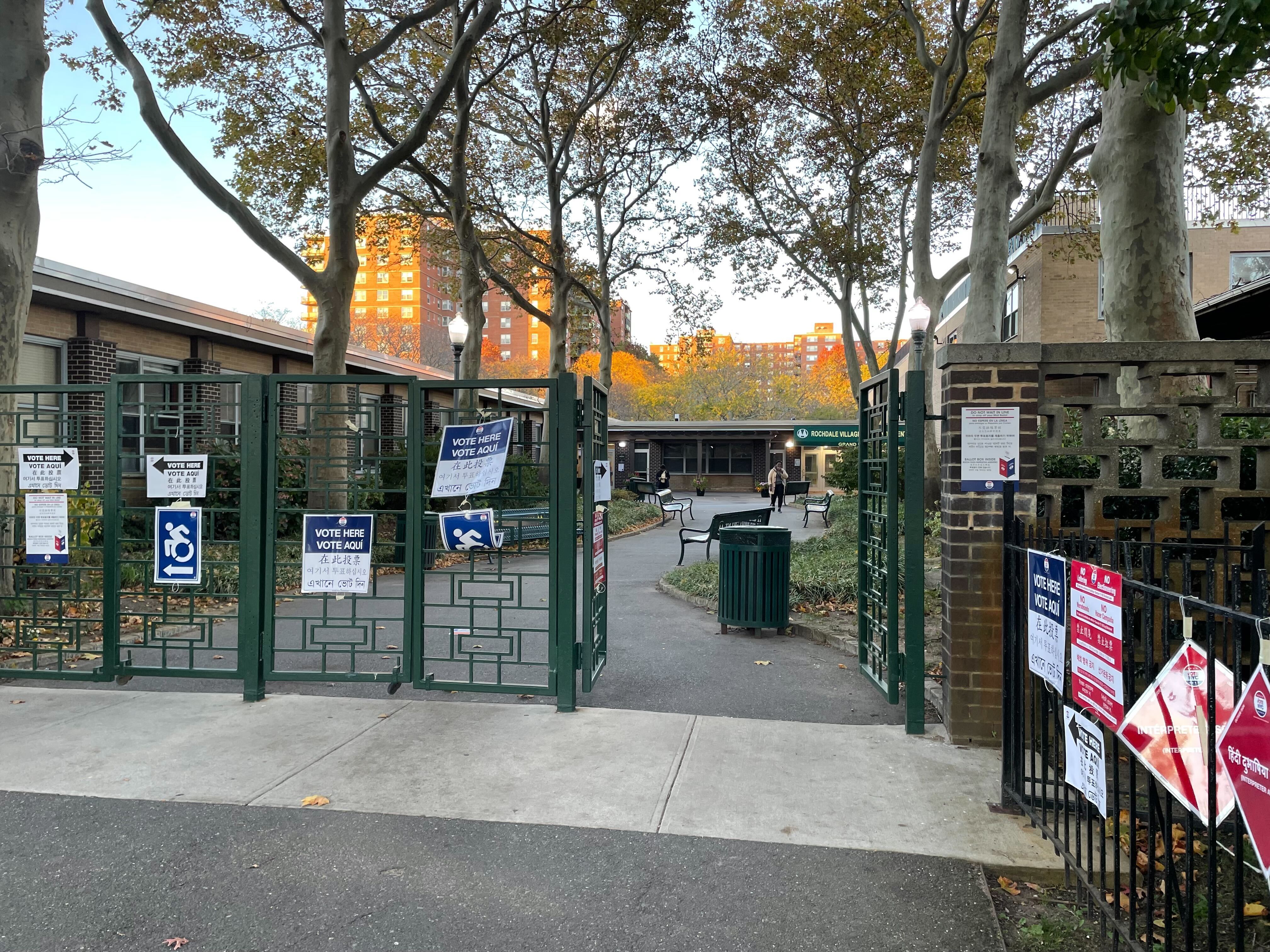 A gate adorned with early voting signs.