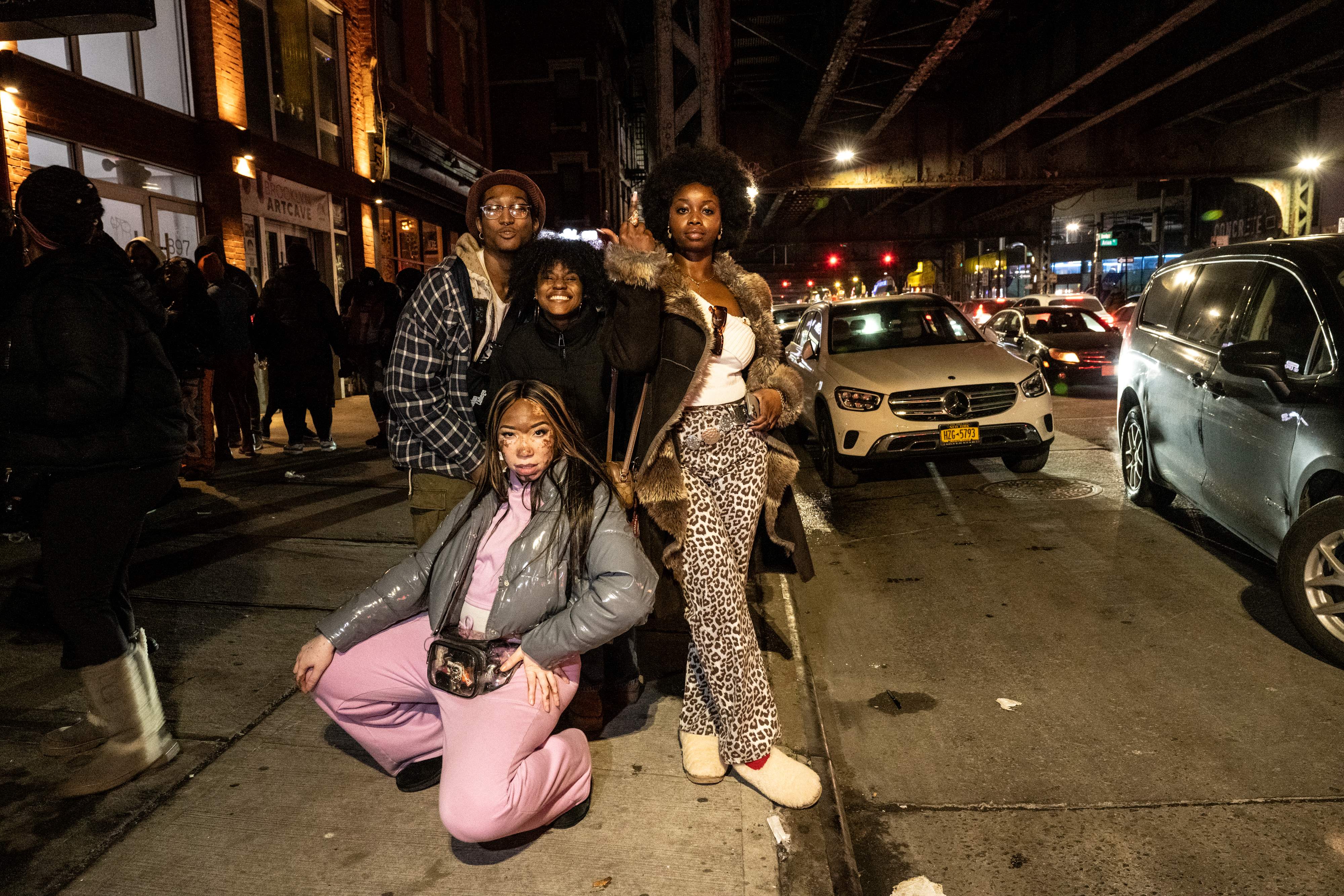 People pose for a photo outside.