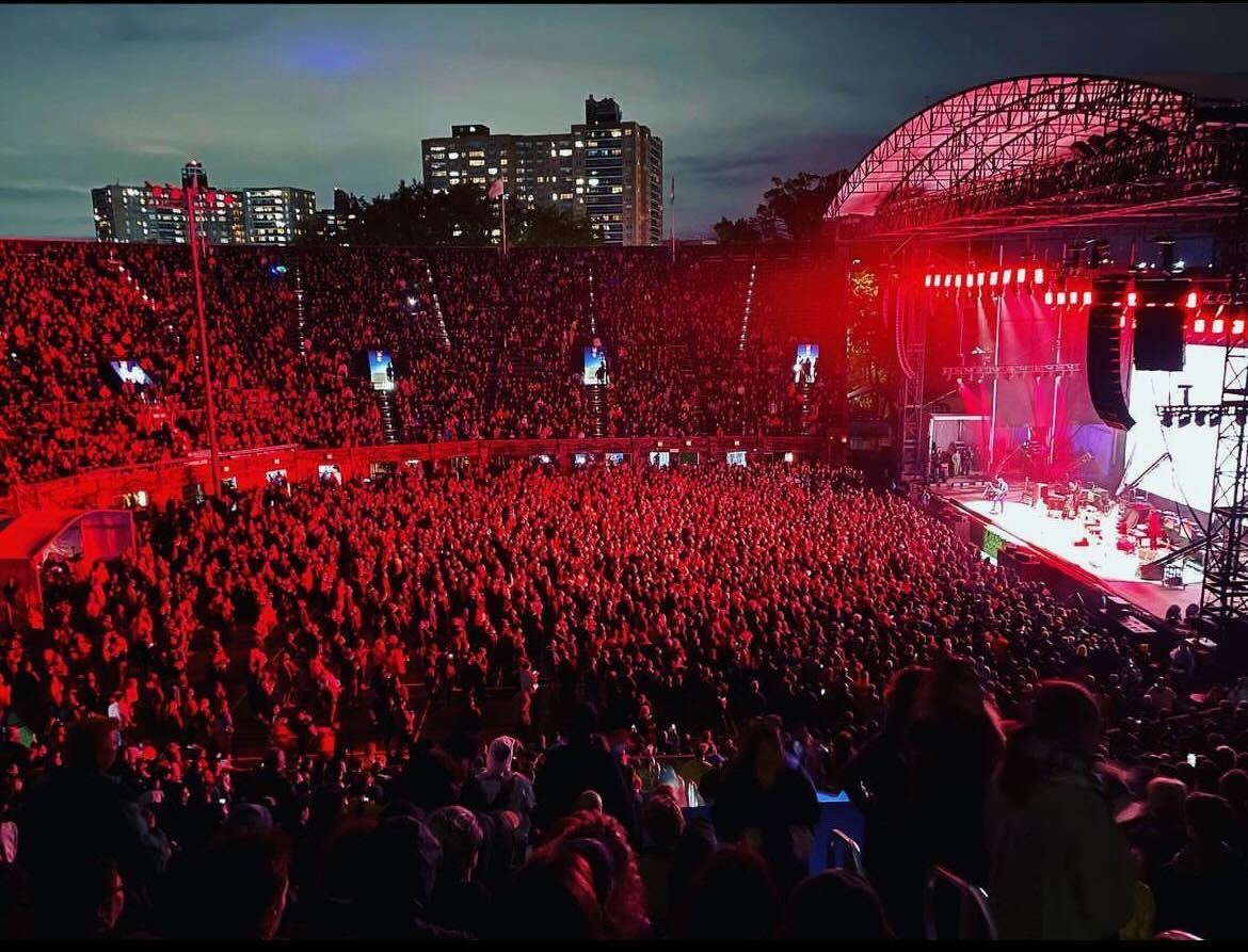 A large crowd at a concert in Forest Hills Stadium.